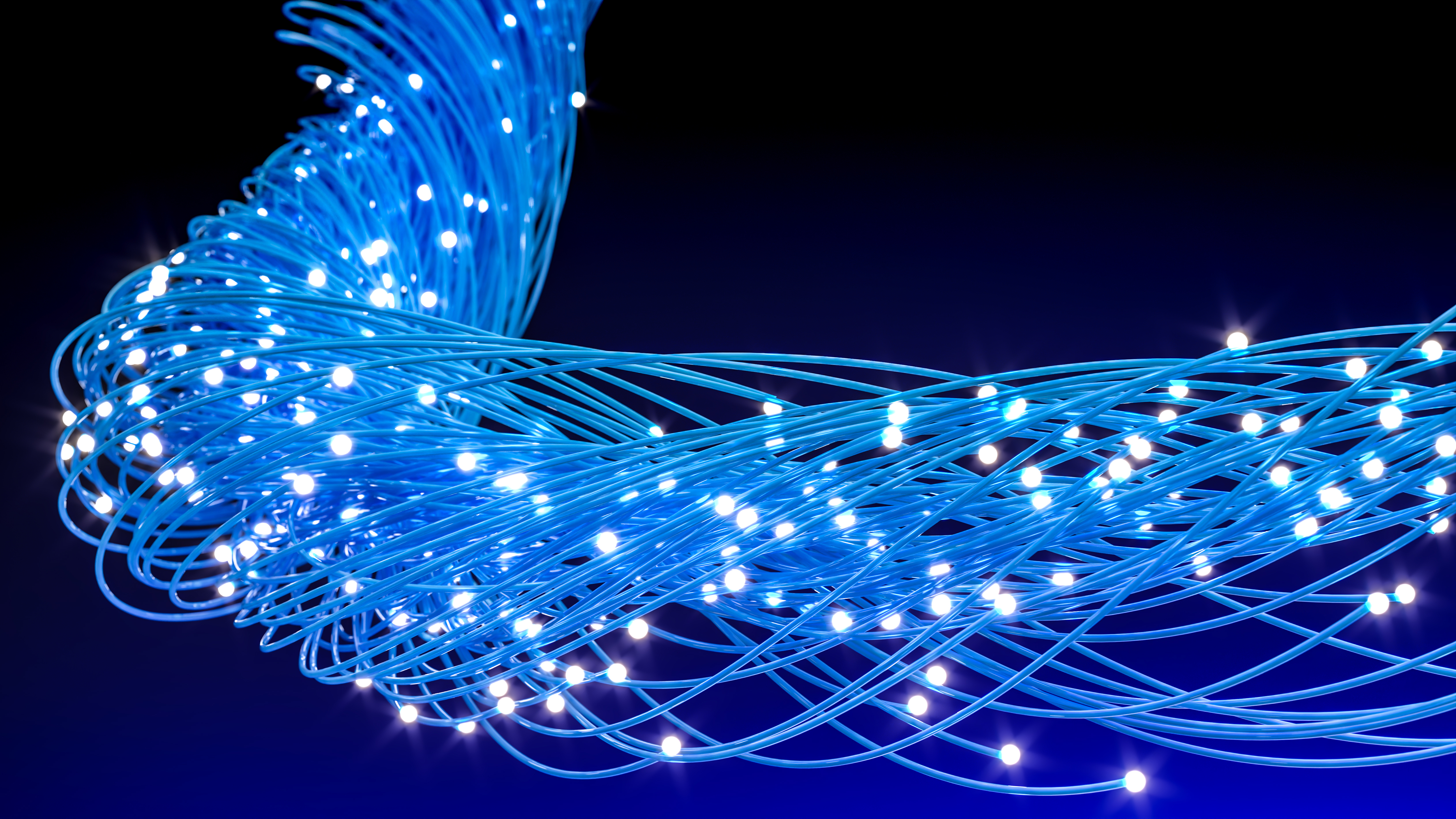 Blue fiber optic cables illustrating global network communication and digital technology